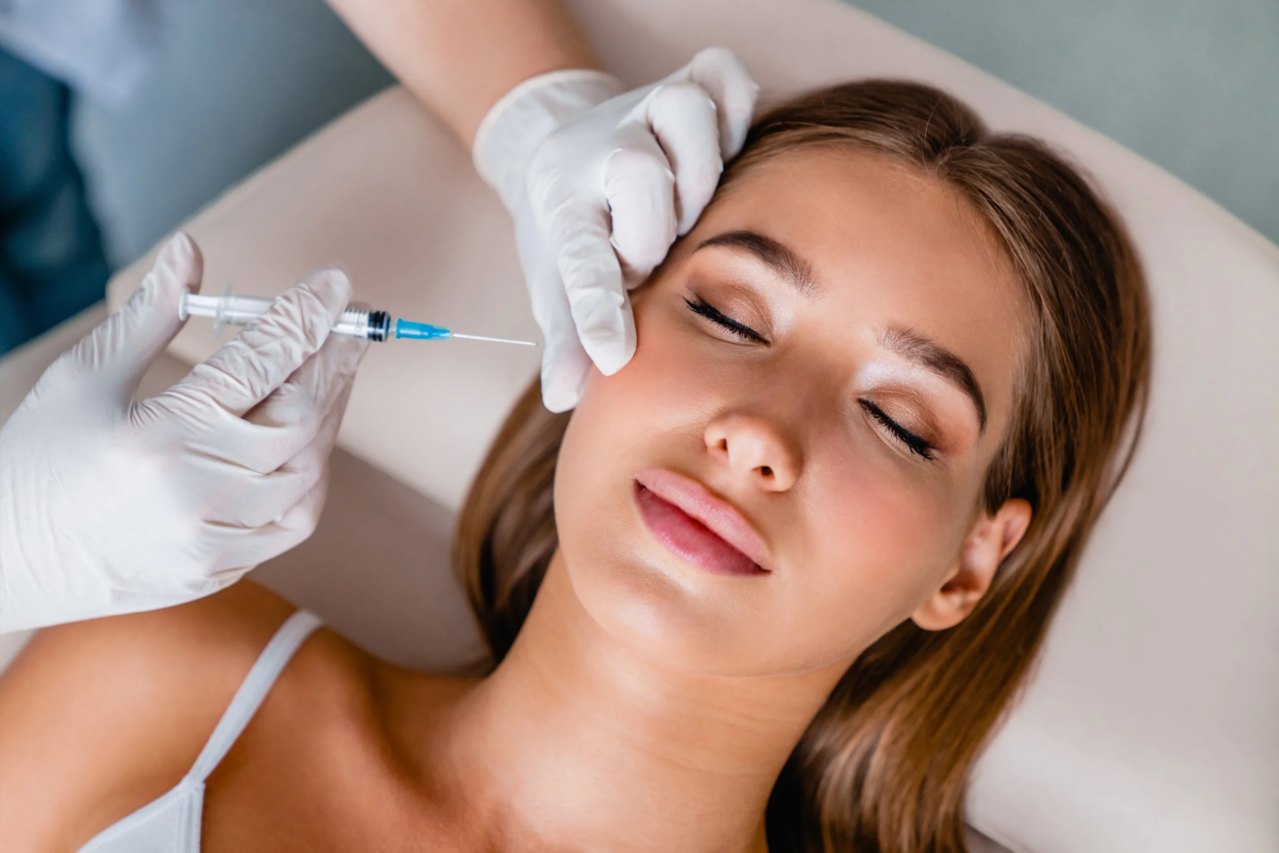 Woman receiving Botox treatment for smoothing fine lines and wrinkles